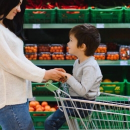 A woman and child shop for healthy foods